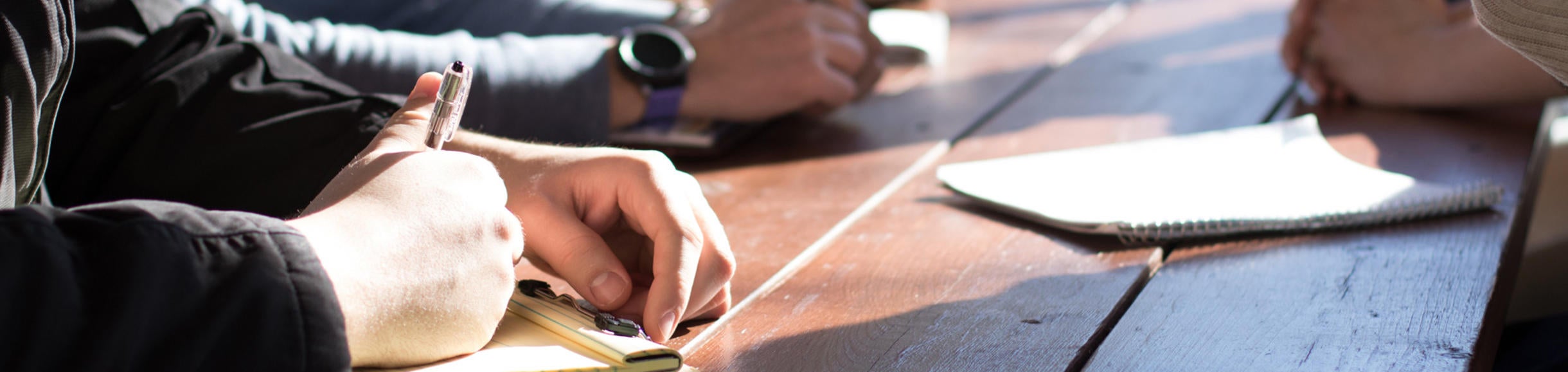 Hands on desk at meeting